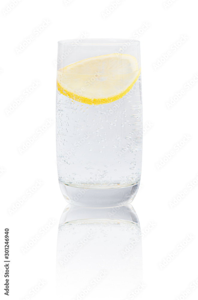 Full glass of gas water with lemon. Full glass of gas water with lemon.