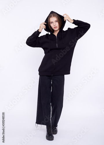 Young girl wearing blank and oversize black long hoody. White background