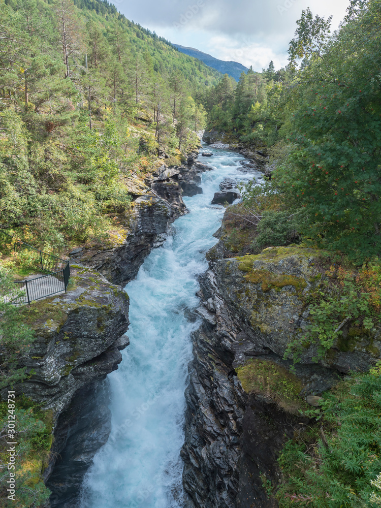 Waterfall Slettafossen at Verma with deep narrow Rauma river canyon at ...