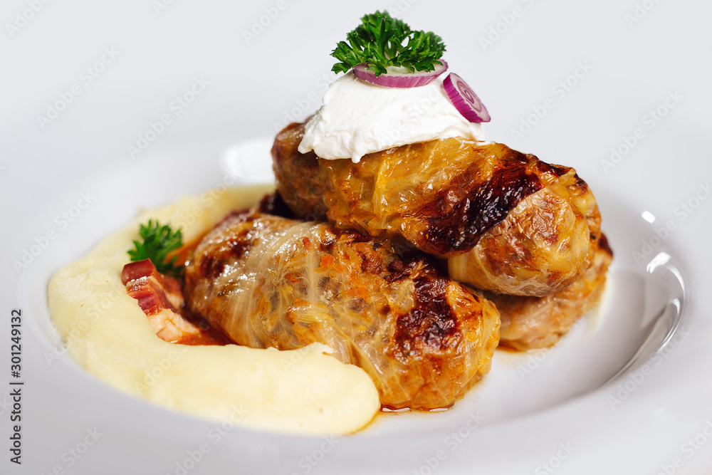Stuffed cabbage rolls with rice and meat in tomato sauce. Stuffed cabbage rolls with rice and meat in tomato sauce.