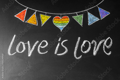 Obraz na płótnie Garland with LGBT symbols drawn on chalk board with inscription love ia love w salonie
