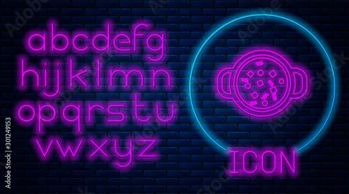 Glowing neon Cooking soup in pot icon isolated on brick wall background. Boil or stew food symbol. Neon light alphabet. Vector Illustration