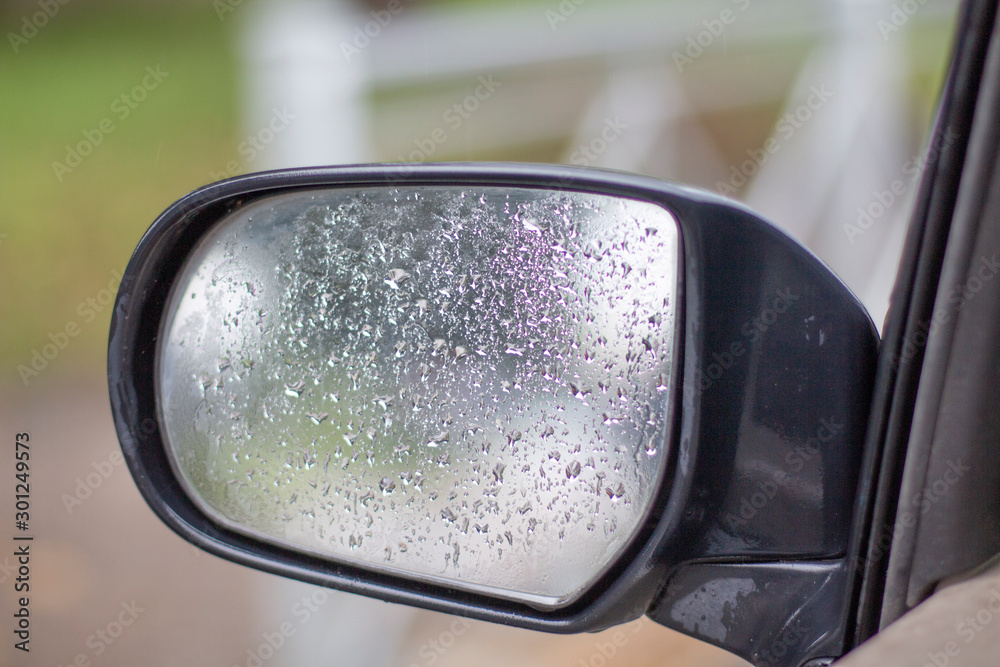 car side mirror with water drops close up car side mirror with water drops close up