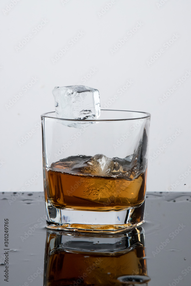 a glass of whiskey, drops, spray, splash of fluid, a stop time, after a hard working day, rest time, Scottish traditions, Irish drink, Bourbon or Scotch, a glass of whiskey, drops, spray, splash of fluid, a stop time, after a hard working day, rest time, Scottish traditions, Irish drink, Bourbon or Scotch,