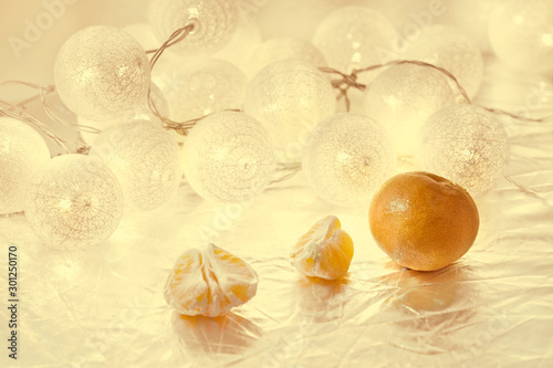 golden christmas balls with tangerines