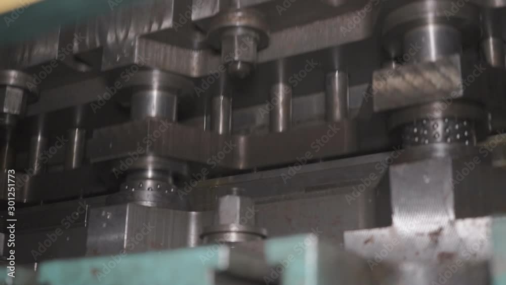 The process of processing metal billets in old machine tools of heavy engineering plants. Moving parts of processing machines The process of processing metal billets in old machine tools of heavy engineering plants. Moving parts of processing machines