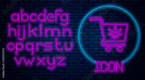 Glowing neon Shopping cart with marijuana or cannabis leaf icon isolated on brick wall background. Online buying. Delivery service. Supermarket basket. Neon light alphabet. Vector Illustration