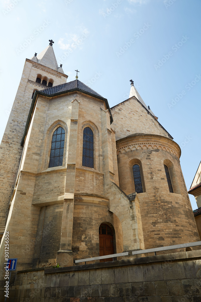 Church of beige brick with large windows in Prague, Czech Republic.