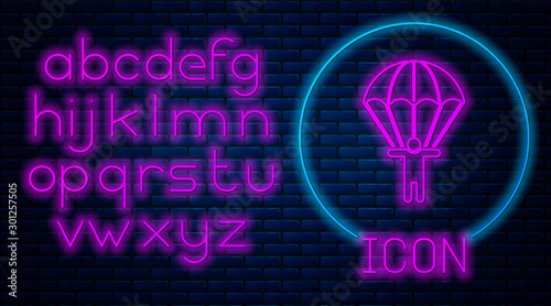 Glowing neon Parachute and silhouette person icon isolated on brick wall background. Neon light alphabet. Vector Illustration