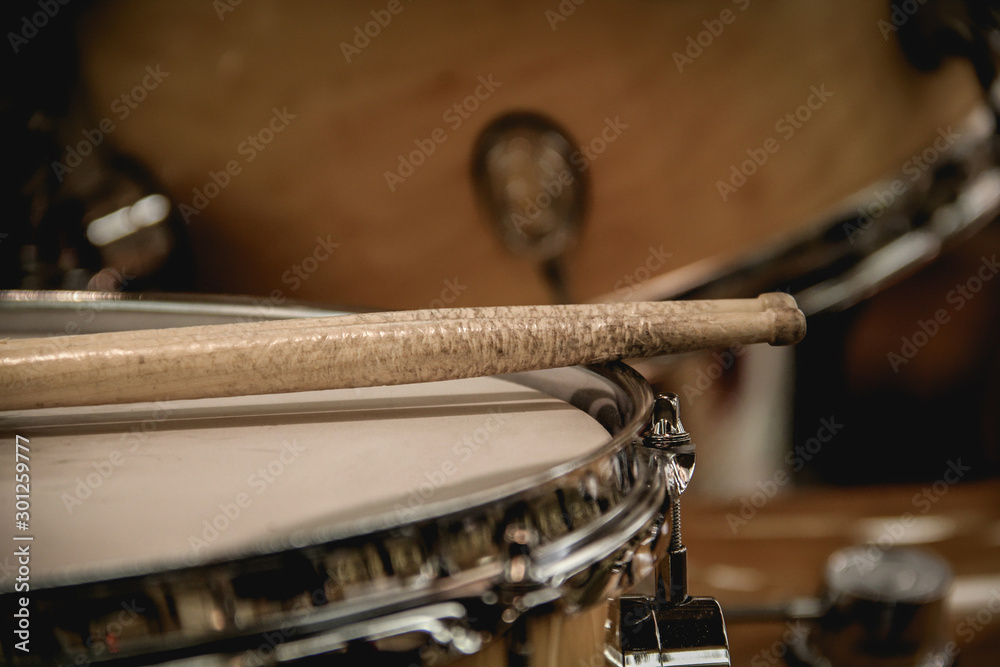 Pair of drumsticks sitting on a snare drum