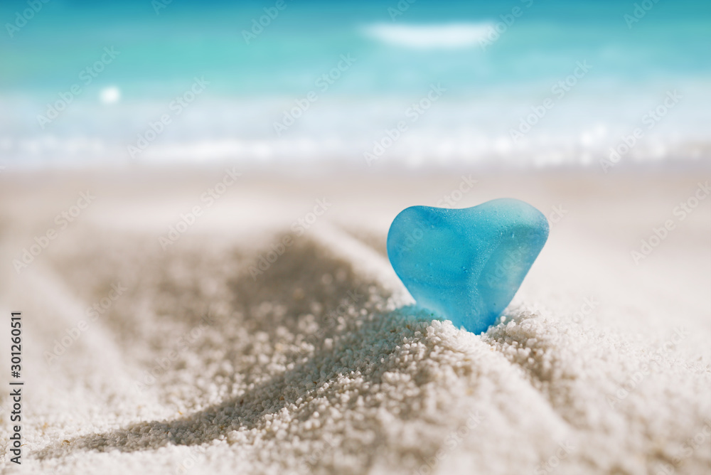 sea glass blue heart on white sand beach sea glass blue heart on white sand beach
