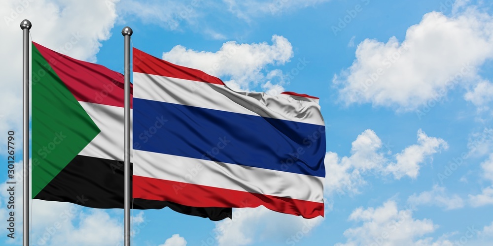 Sudan and Thailand flag waving in the wind against white cloudy blue sky together. Diplomacy concept, international relations.