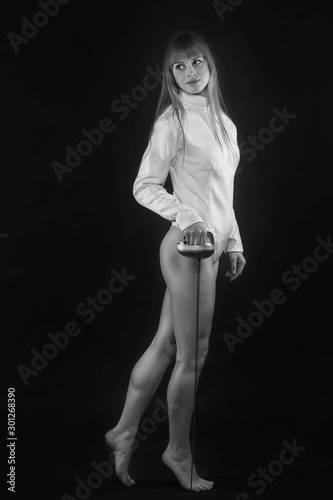 fencer. girl athlete with a rapier black and white photo