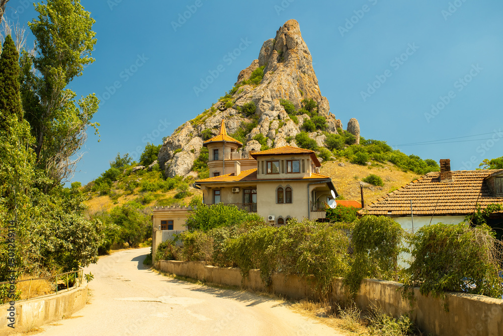 House With Honey Mountain On Background In Kurortnoe Settlement, Crimea, Russia.