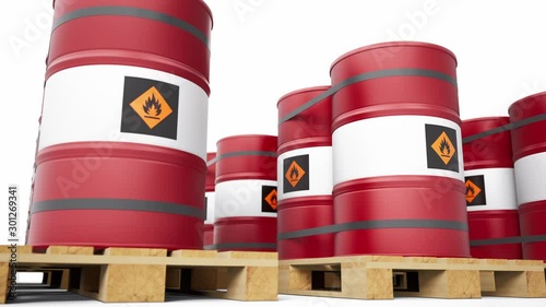 Red metal barrels with flammable symbol stacked in endless row on wooden pallets. Low angle view of palleted fuel drums. 60 fps seamless loop animation. 