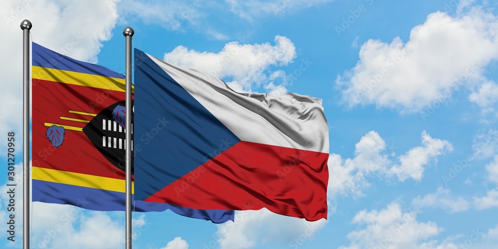 Swaziland and Czech Republic flag waving in the wind against white cloudy blue sky together. Diplomacy concept, international relations.