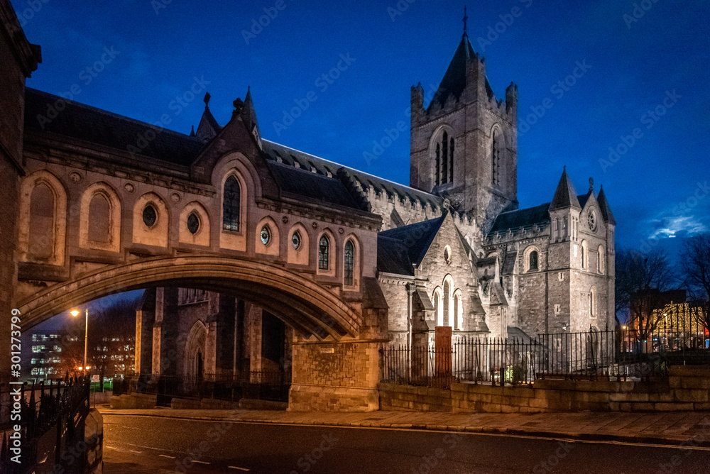 DUBLIN, IRELAND, DECEMBER 21, 2018: Christ Church Cathedral and bridge to former Synod Hall after sunset while moon is rising.