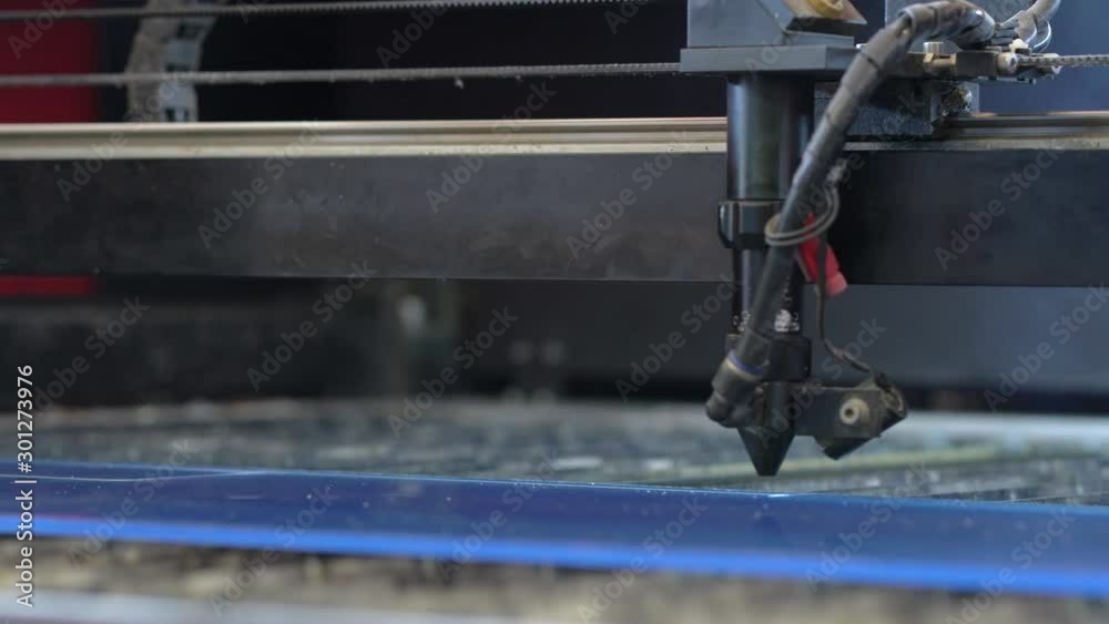 Laser cutting machine carving patterns on the plastic plate Laser cutting machine carving patterns on the plastic plate