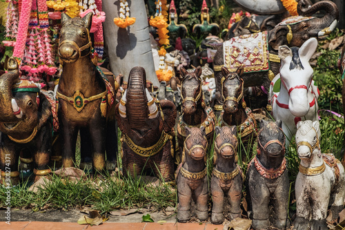 Animal statues decorated with flowers located near the Phra Nakhon Si Ayutthaya Provincial City Pillar Shrine. It is a small and mostly overseen temple in the historic district of Ayutthaya, Thailand.