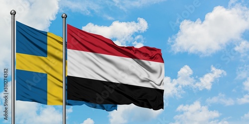 Sweden and Yemen flag waving in the wind against white cloudy blue sky together. Diplomacy concept  international relations.