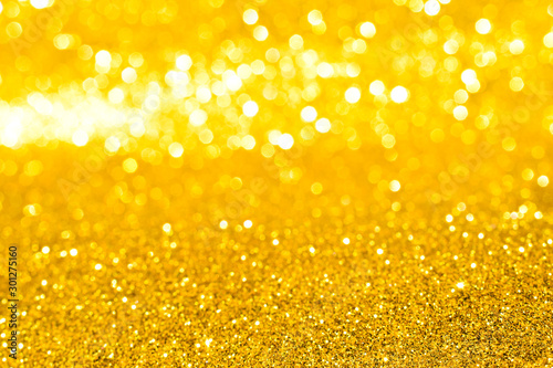 sparkles of golden glitter texture background 