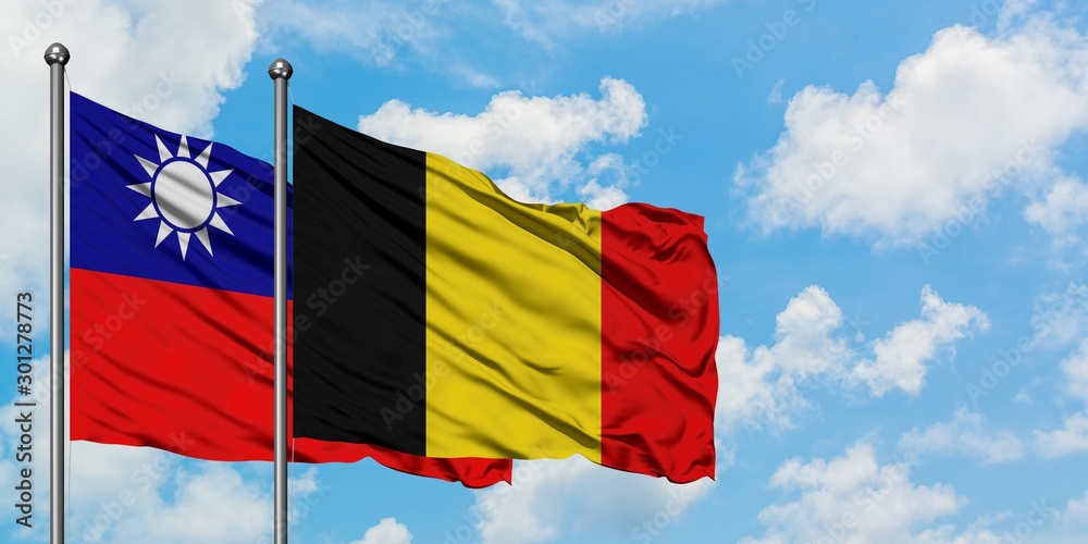 Taiwan and Belgium flag waving in the wind against white cloudy blue sky together. Diplomacy concept, international relations.