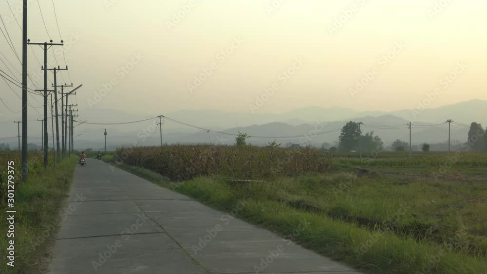 road and moutain sunset time in rural city in thailand , asian concept. road and moutain sunset time in rural city in thailand , asian concept.