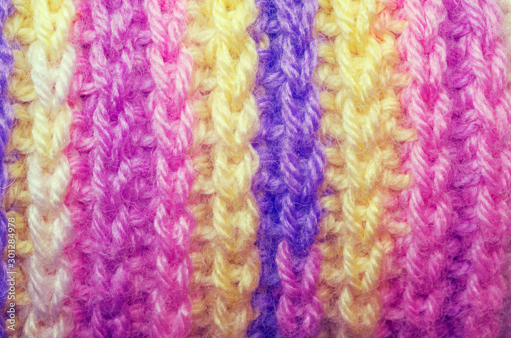 Beautiful texture of a knitted scarf. Colorful winter clothes.