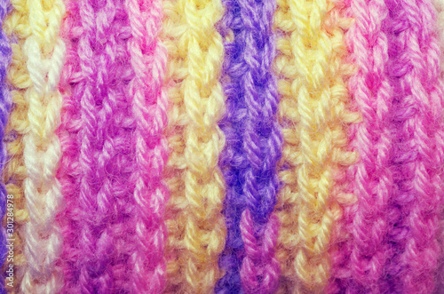 Beautiful texture of a knitted scarf. Colorful winter clothes.