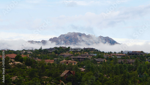 Granite Mountain clothed in clouds as morning comes to Northern Arizona