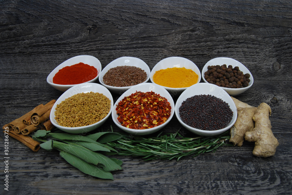 Herbs and spices on a rustic background Herbs and spices on a rustic background