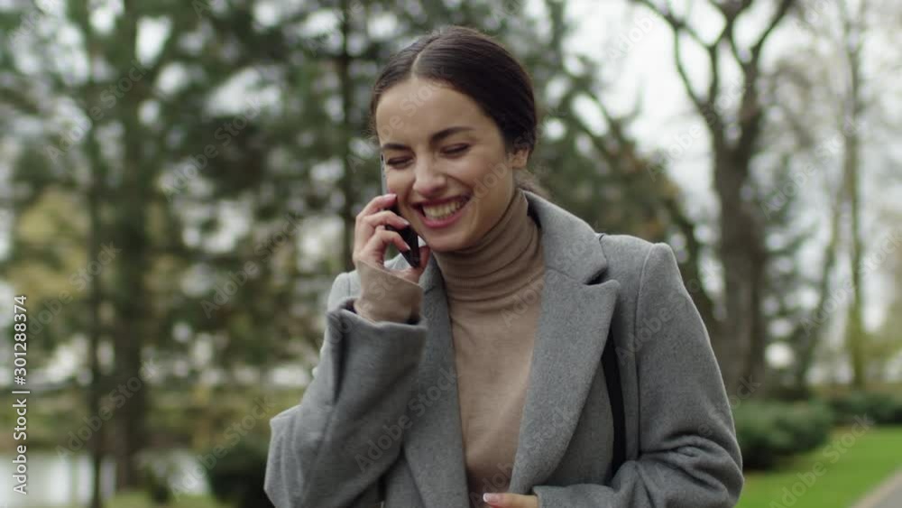 Young elegant happy girl talks on phone and laughs. Highest degree of joy. Young elegant happy girl talks on phone and laughs. Highest degree of joy.