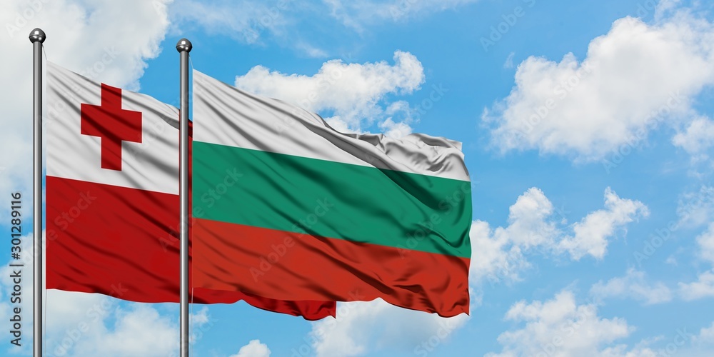 Tonga and Bulgaria flag waving in the wind against white cloudy blue sky together. Diplomacy concept, international relations.