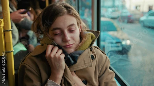 Close up young attractive woman feel cold bad sick on the tram on autumn day flu season disease fever grippe health illness infection influenza migraine sickness slow motion