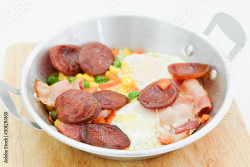 Breakfast with fried eggs in pan