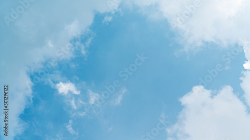 White cloud and blue sky background with copy space