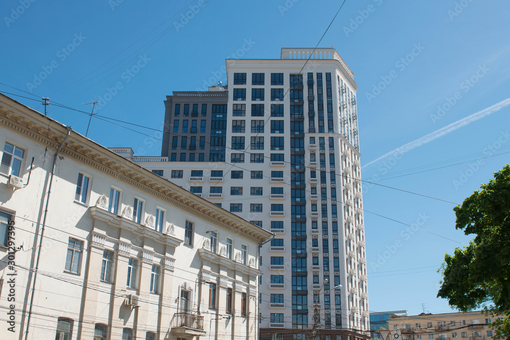 City street on a sunny day with a blue sky.