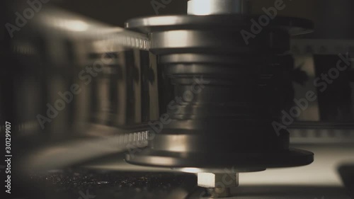 filmstrip film projector playing in the night. 35mm filmstrip. Macro film frame