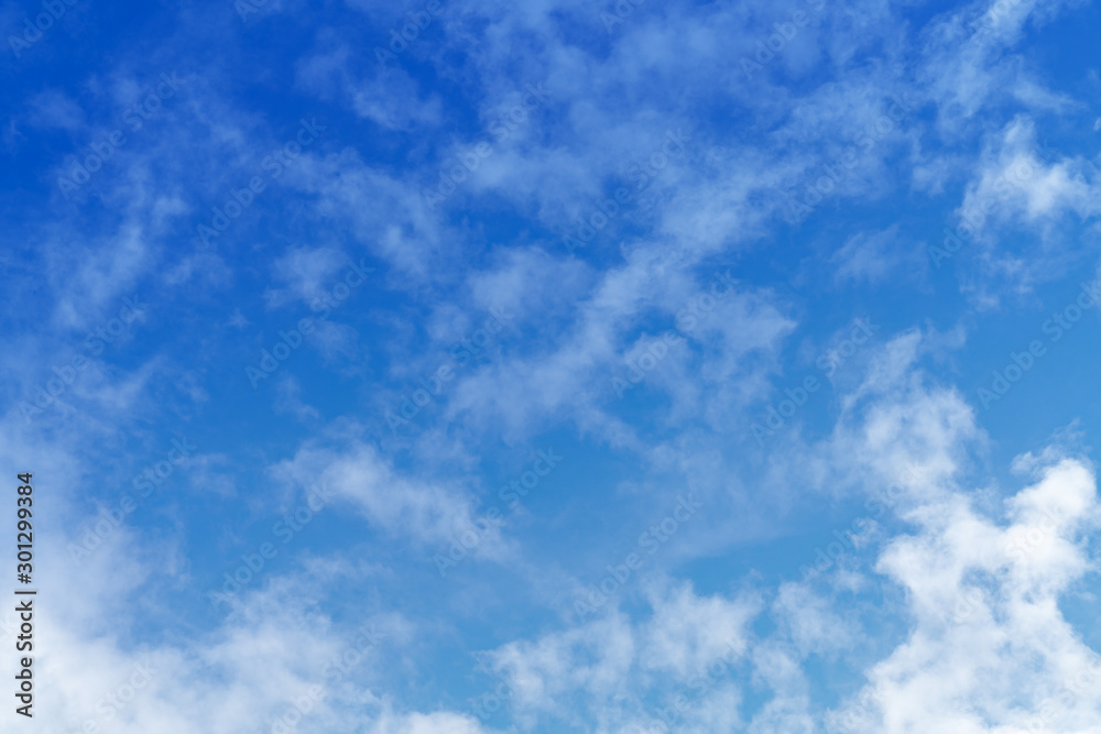 White cloud and blue sky background with copy space