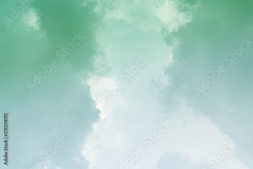 Obraz na plátne White cloud and green sky background with copy space