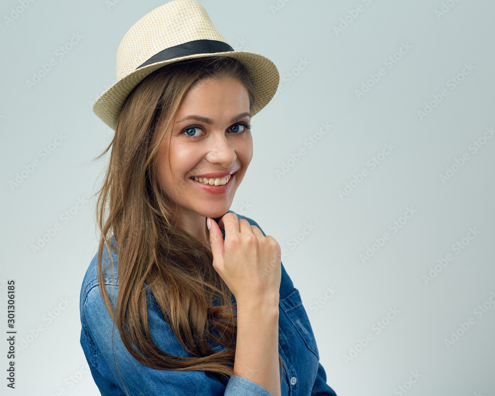 smiling woman wearing hat touching chin. smiling woman wearing hat touching chin.
