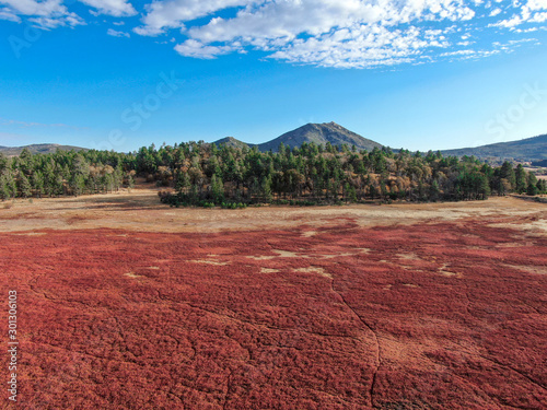 Aerial view of dry Lake Cuyamaca, 110 acres reservoir and a recreation area in the eastern Cuyamaca Mountains, located in eastern San Diego County, California, USA photo