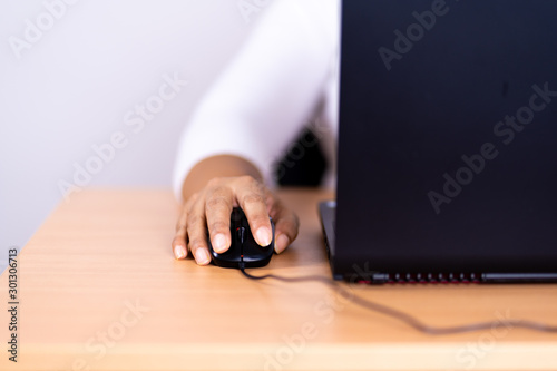 Female hand holding computer mouse