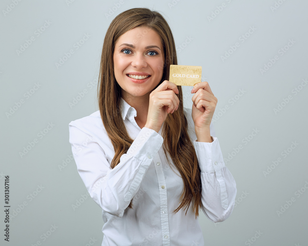 Happy woman in white shirt holding credit card. Happy woman in white shirt holding credit card.