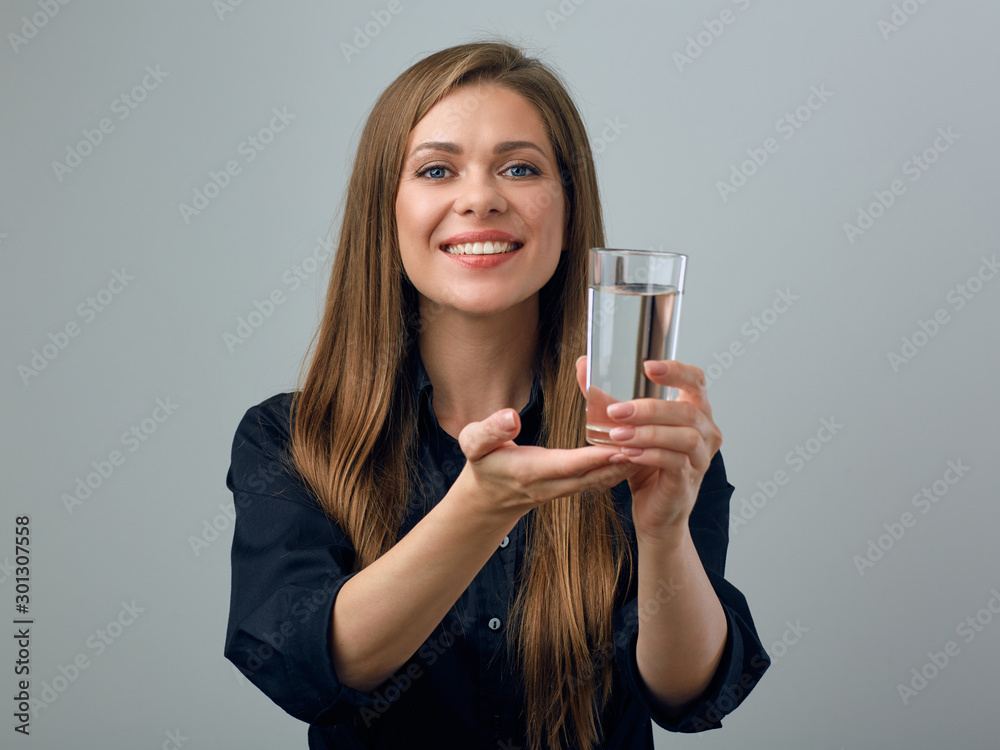 young woman in black dress holding water glass. young woman in black dress holding water glass.