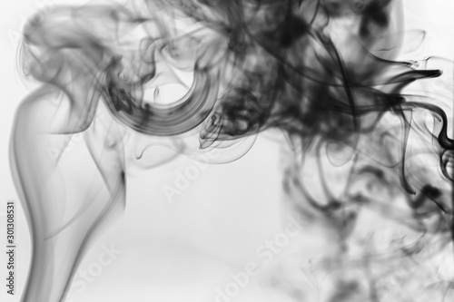 Black smoke on a light background. Abstract background stylish monochrome photo.