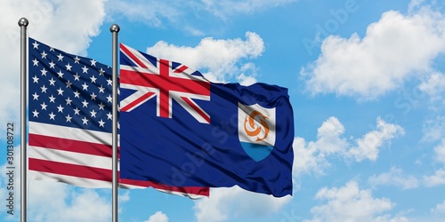 United States and Anguilla flag waving in the wind against white cloudy blue sky together. Diplomacy concept, international relations.