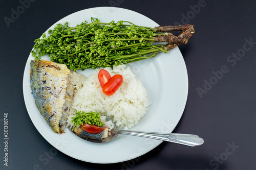 Fish grilled and Neem with sweet sauce. Tamarind Sweet & Sour Dip or Thai Dipping Sauce with boiled Neem (Thai name is Sadao nam pla wan). Neem is a Thai herb with bitter taste.  photo