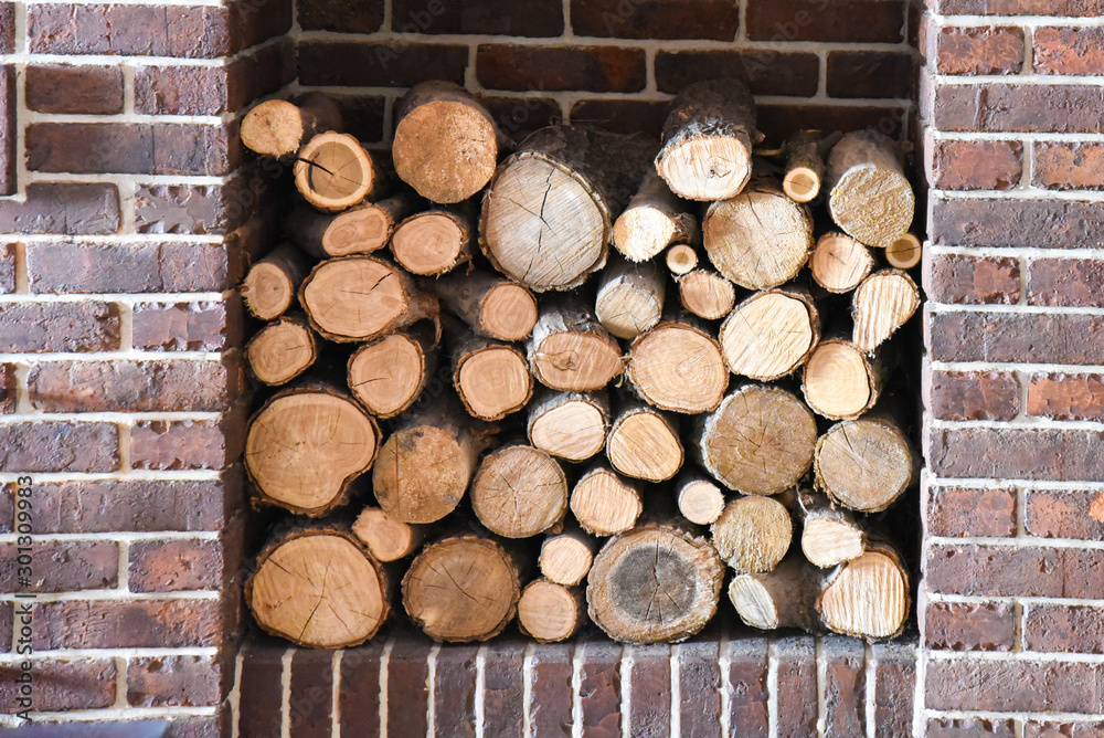 Stacked wooden logs in a niche. The wood in the fireplace. Stock Photo |  Adobe Stock