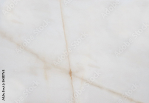 Patterns in the form of a star from marble of different colors, pink pattern on a light background, gray-white marble